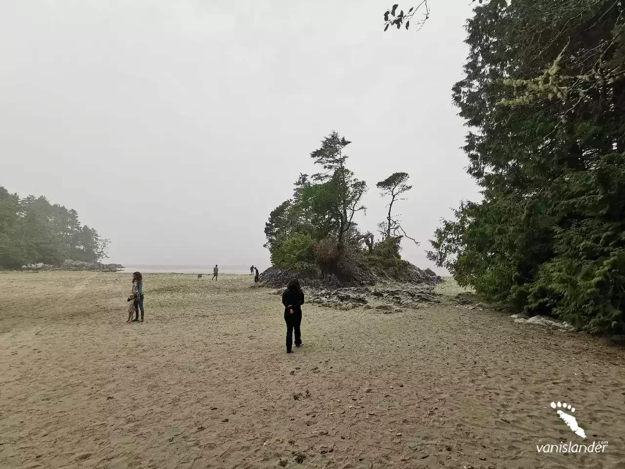 People waling on the beach at Tonquin Park -  Vancouver Island